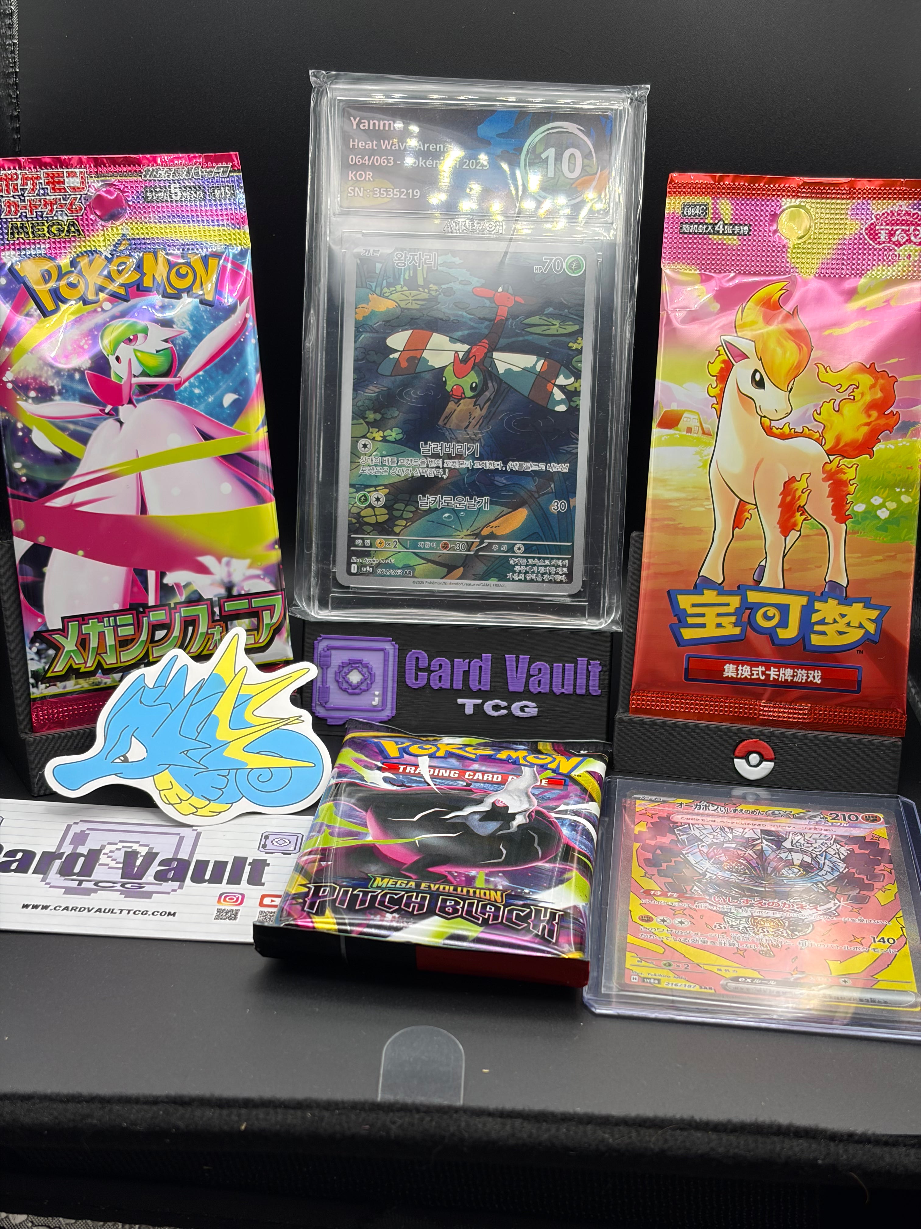 Pokemon Mystery bag with 1 graded slab, 3 booster packs, 1 AR card & a sticker